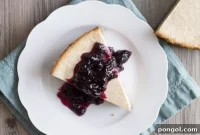 Decadent Dairy-Free Lemon Ricotta Cheesecake with Berry White Wine Compote