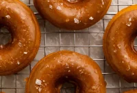 Spiced Vegan Pumpkin Doughnuts Drizzled with Salted Caramel