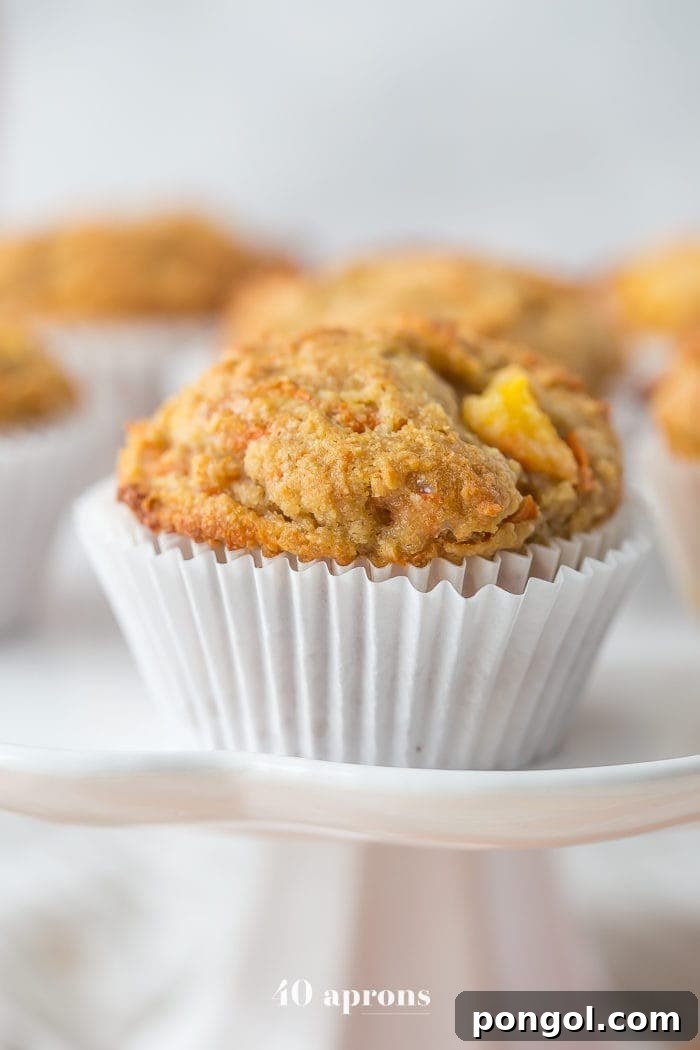 Delightfully moist and tender peach ginger paleo muffins, perfect for a healthy, grain-free breakfast or snack.