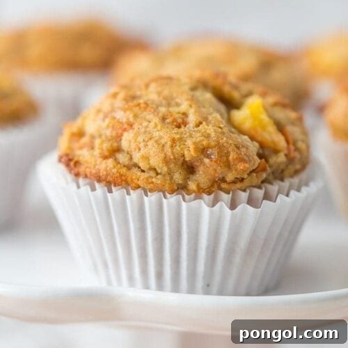 Moist and flavorful peach ginger paleo muffins, perfect for a healthy breakfast.