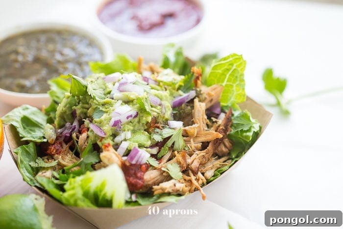 Chipotle Inspired Whole30 Carnitas Power Bowl 3 A vibrant and healthy Whole30 carnitas bowl, artfully assembled to mimic your Chipotle favorite, perfect for clean eating.