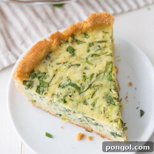 This paleo quiche with crab and spinach is a fantastic paleo Mother's Day brunch recipe, but it's versatile and quick enough to become a favorite paleo dinner or paleo brunch dish in your rotation. With an almond flour crust, this paleo quiche is so much like a cheesy, gluteny quiche!