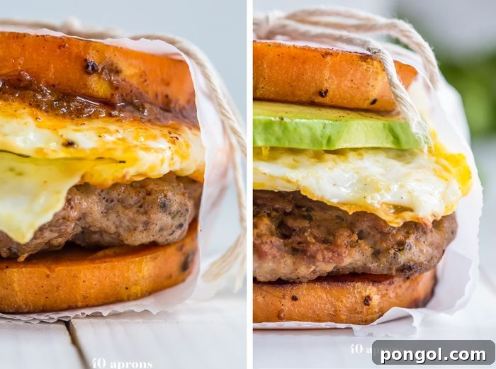 Two Whole30 breakfast sandwiches with sweet potato buns, sausage, fried egg, and avocado