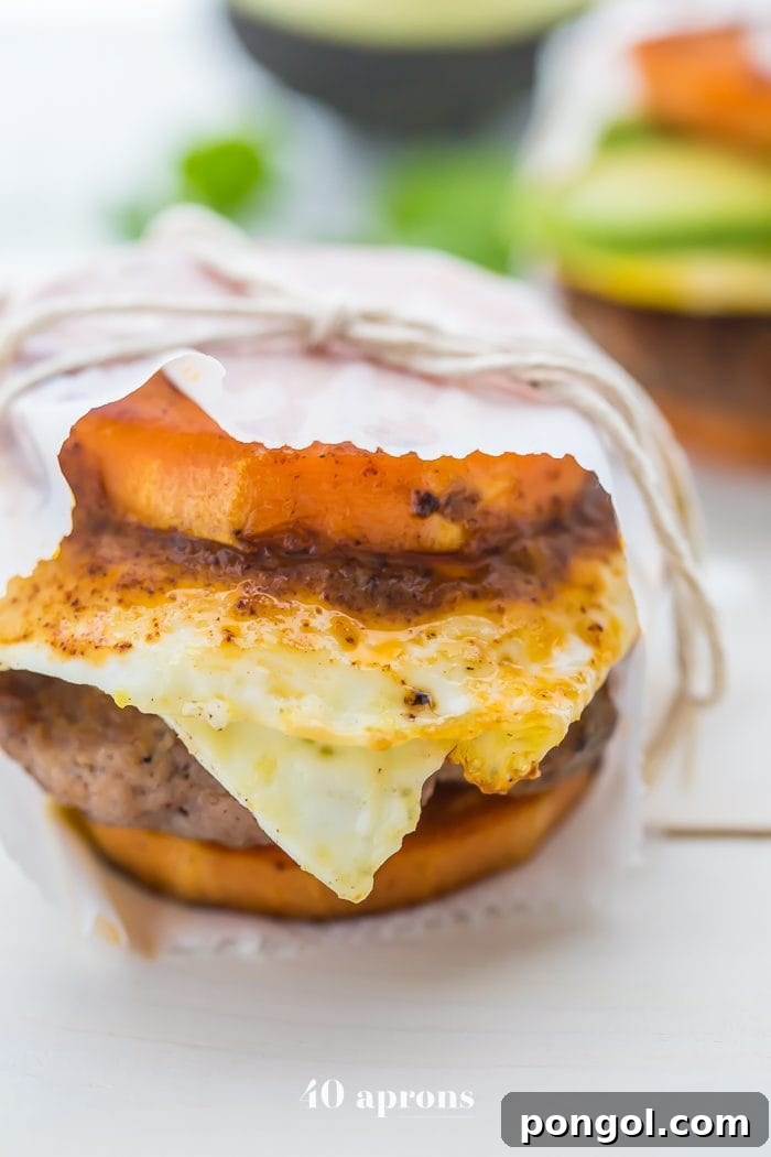 Whole30 breakfast sandwich with sweet potato buns, egg, and chipotle aioli