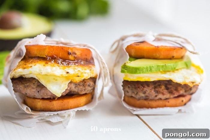 Whole30 breakfast sausage patties and sweet potato buns cooking in a cast-iron skillet