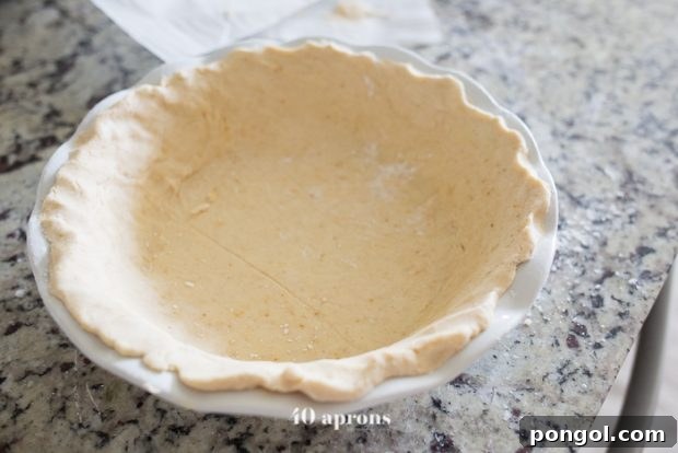 Guilt-Free Paleo American Flag Pie 8 Rolling out paleo pie crust on parchment paper
