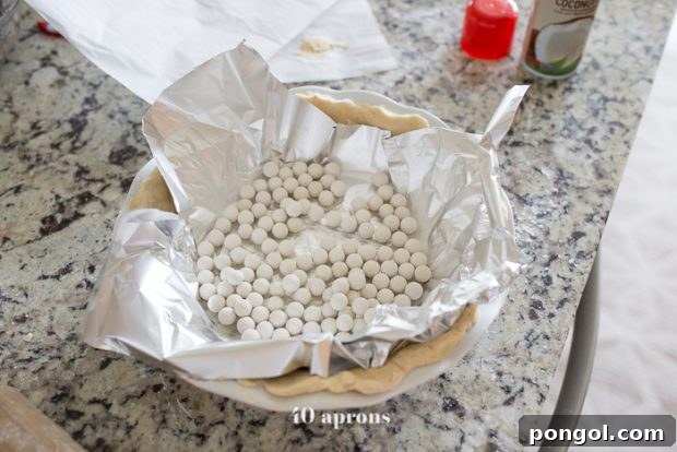 Guilt-Free Paleo American Flag Pie 9 Paleo pie crust being blind-baked with pie weights