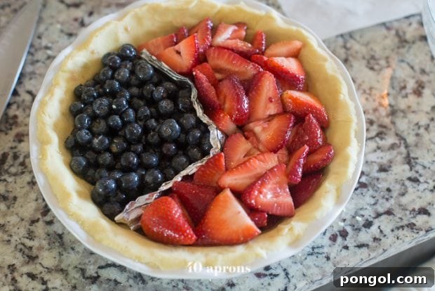 Guilt-Free Paleo American Flag Pie 11 Blueberries and strawberries in paleo pie crust before topping