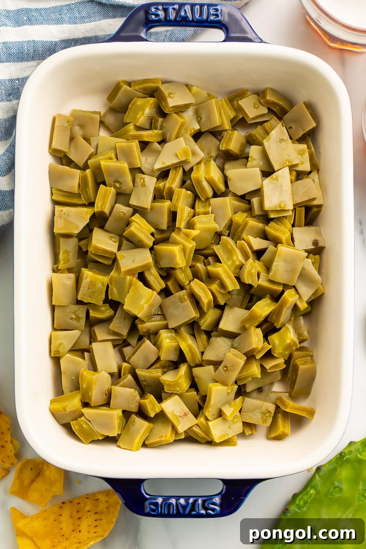 Top-down photo of a casserole dish filled with diced nopales.
