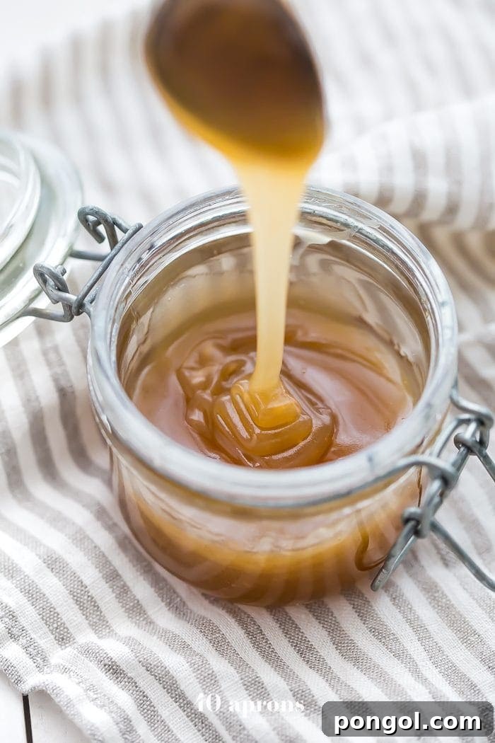 Delicious 5-Minute Paleo Vegan Caramel Sauce in a glass jar, perfect for healthy desserts