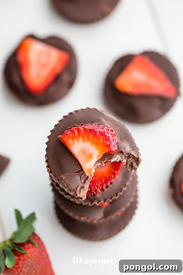 A plate of freshly made Vegan Paleo Chocolate Strawberry Coconut Butter Cups