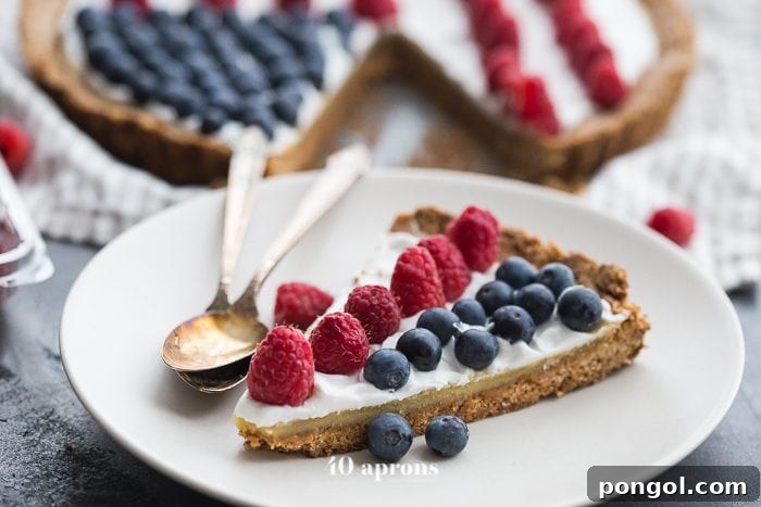 The finished Paleo Flag Fruit Tart, a delightful and healthy dessert, presented in a fluted tart pan, ready to be served at any patriotic gathering.