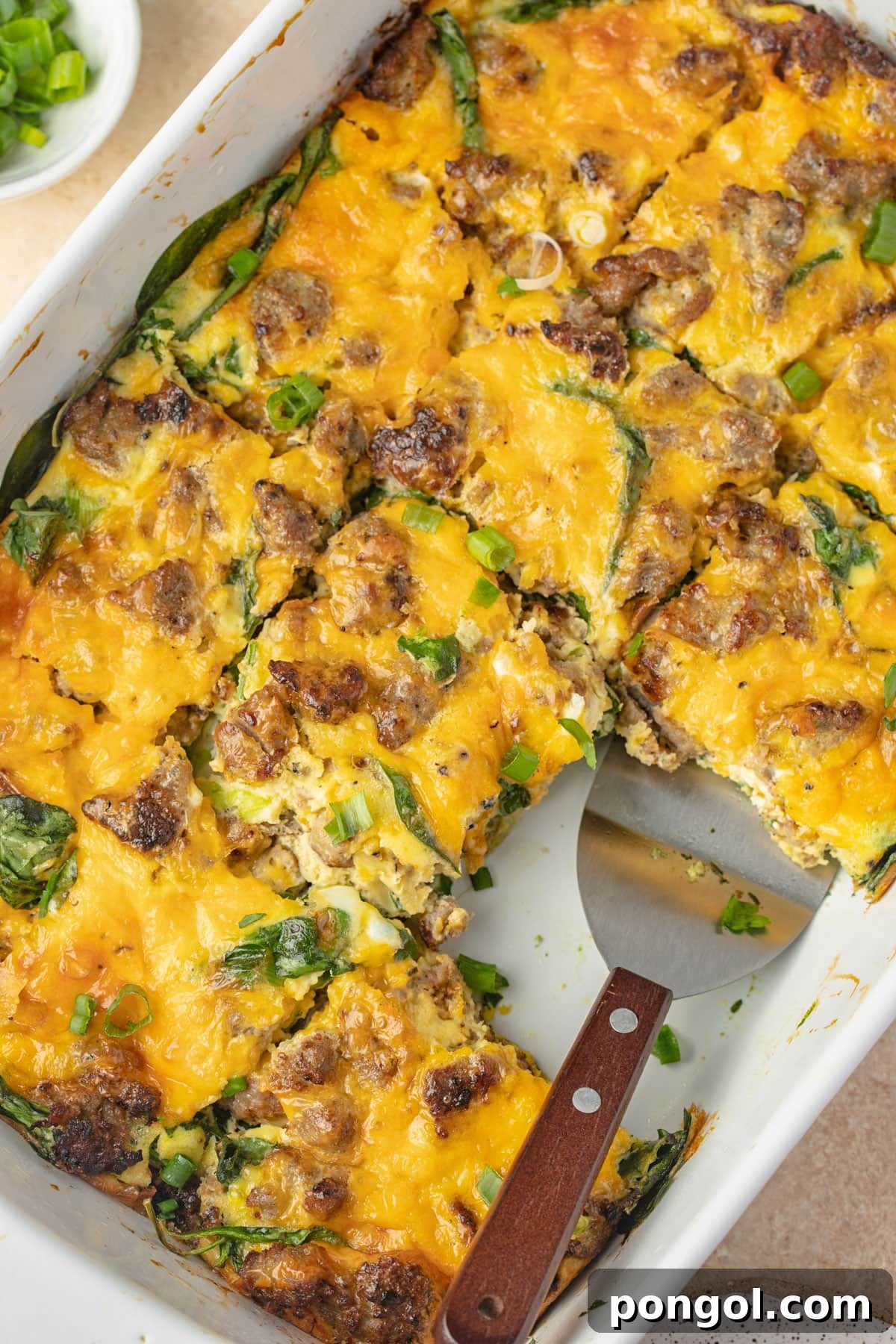 30 Festive Casseroles Your Holiday Table Needs 12 Overhead view of a keto sausage, egg, and cheese breakfast casserole in a casserole dish.