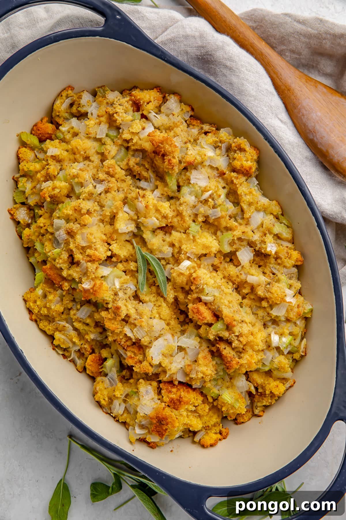 30 Festive Casseroles Your Holiday Table Needs 20 Overhead view of cornbread stuffing in a large blue casserole dish.