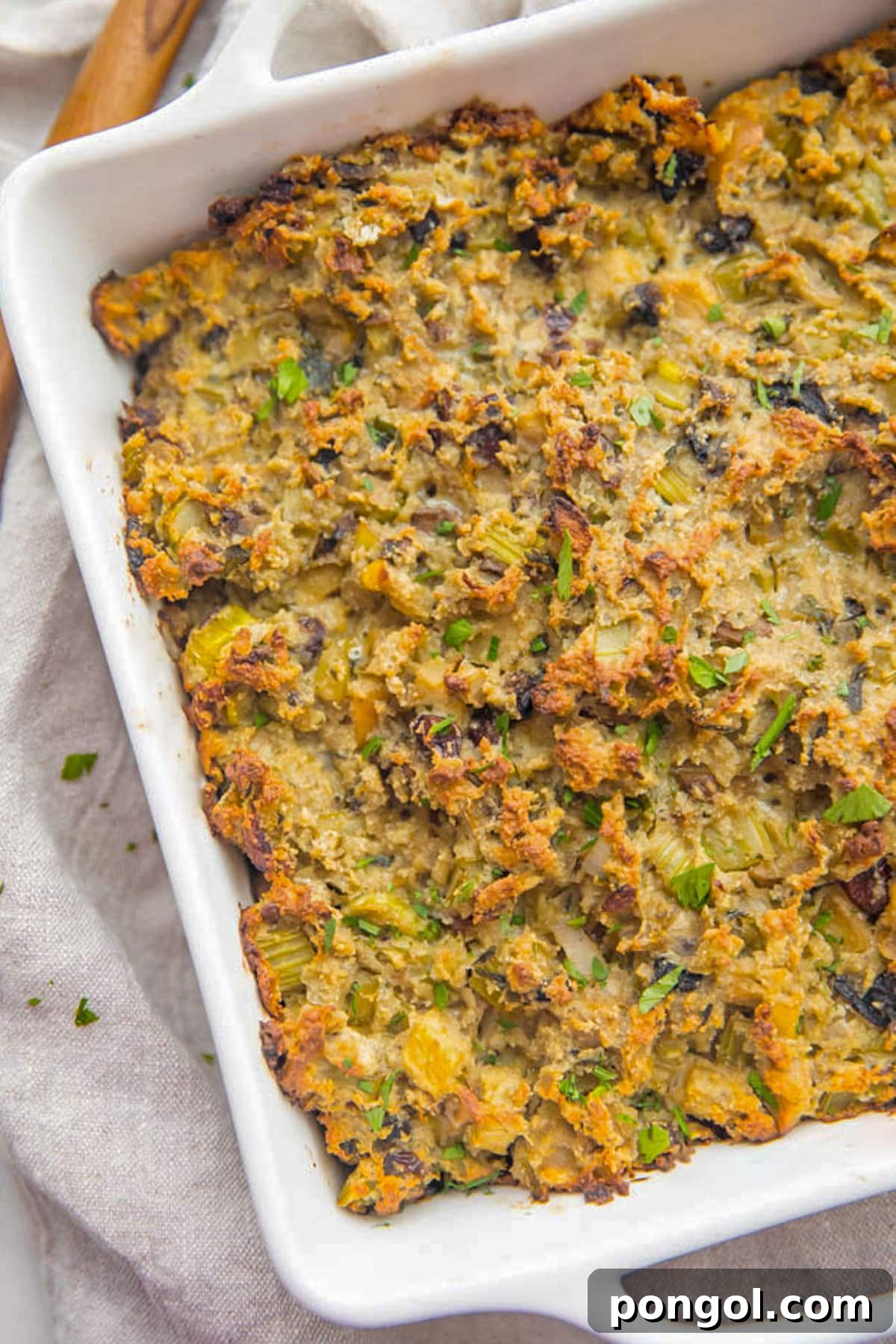 30 Festive Casseroles Your Holiday Table Needs 24 A white square casserole dish holding the best paleo stuffing.