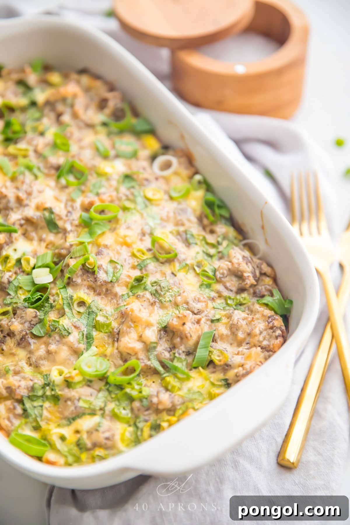 30 Festive Casseroles Your Holiday Table Needs 10 Whole30 sausage, egg, and hashbrown breakfast casserole in a casserole dish.