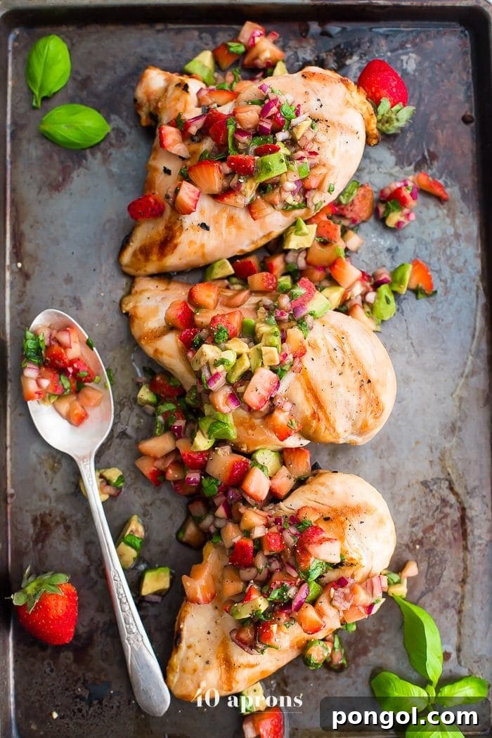 Delicious Whole30 Strawberry Basil Grilled Chicken with creamy avocado salsa, perfect for a healthy and sweet-savory dinner