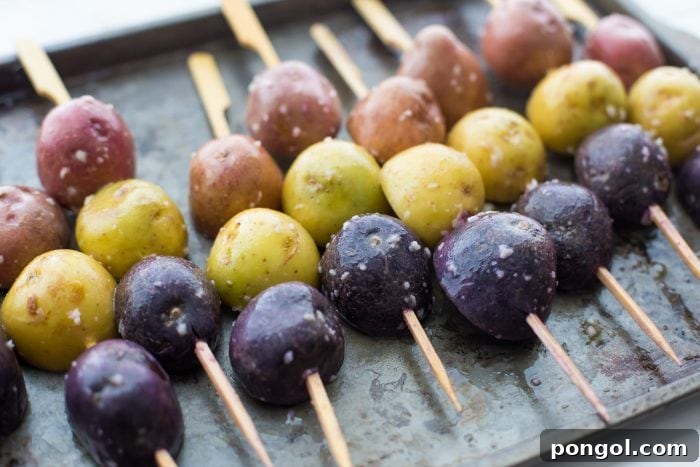 Close-up of grilled potato skewers showcasing the red, white, and blue colors.
