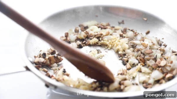 Sauté onion and diced mushrooms until soft