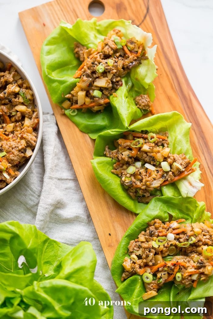 A close-up view of healthy PF Changs style lettuce wraps, showcasing the vibrant filling and fresh lettuce.