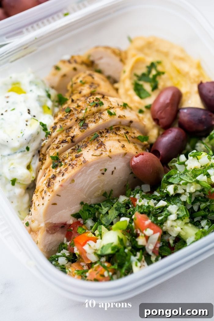 This Greek healthy meal prep recipe is epic: cauliflower rice tabbouleh, tender seasoned chicken breasts, hummus or baba ganoush, kalamata olives, and a rich, garlicky tzatziki. This healthy meal prep recipe will have you looking forward to lunch all morning! It's also a Whole30 meal prep recipe and paleo meal prep recipe, too, when you sub coconut cream or coconut yogurt for the yogurt. This is seriously SUCH a perfect healthy meal prep recipe.