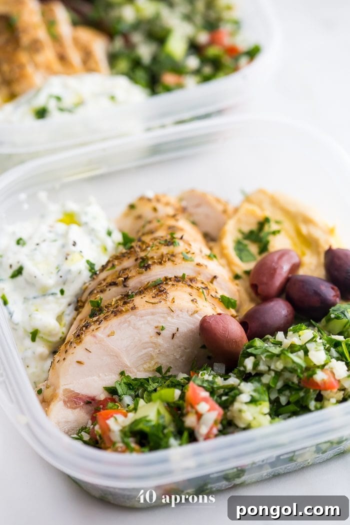 This Greek healthy meal prep recipe is epic: cauliflower rice tabbouleh, tender seasoned chicken breasts, hummus or baba ganoush, kalamata olives, and a rich, garlicky tzatziki. This healthy meal prep recipe will have you looking forward to lunch all morning! It's also a Whole30 meal prep recipe and paleo meal prep recipe, too, when you sub coconut cream or coconut yogurt for the yogurt. This is seriously SUCH a perfect healthy meal prep recipe.