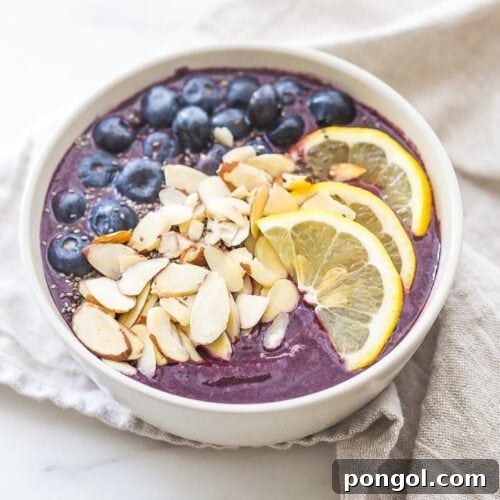 This blueberry muffin smoothie bowl is sweet with a touch of lemon and vanilla, just like a blueberry muffin! This blueberry smoothie bowl takes only 5 minutes and is paleo and vegan. With only 5 ingredients, you'll get addicted to this blueberry muffin smoothie bowl!
