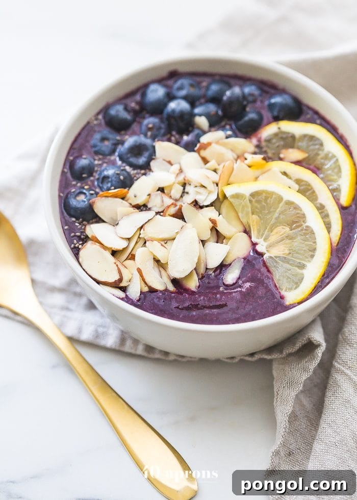 This blueberry muffin smoothie bowl is sweet with a touch of lemon and vanilla, just like a blueberry muffin! This blueberry smoothie bowl takes only 5 minutes and is paleo and vegan. With only 5 ingredients, you'll get addicted to this blueberry muffin smoothie bowl!