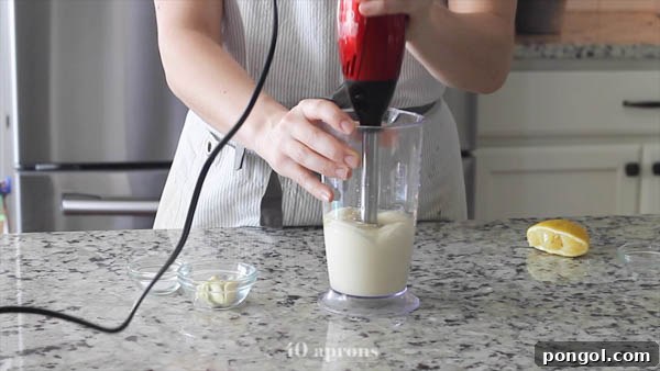 Detailed shot of an immersion blender creating the smooth emulsion for Whole30 mayo.