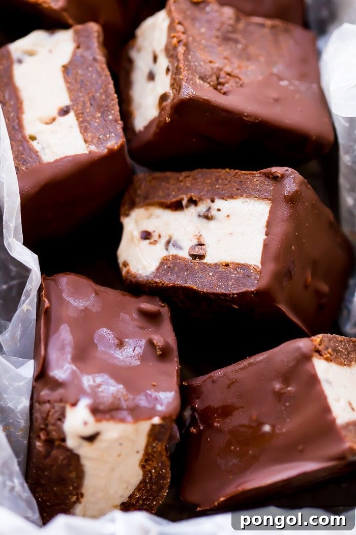 A stack of healthy vegan ice cream sandwiches, showcasing the decadent chocolate coating.