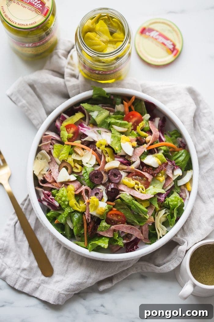 Vibrant Paleo Italian Salad with radicchio, salami, and olives, served in a large bowl.