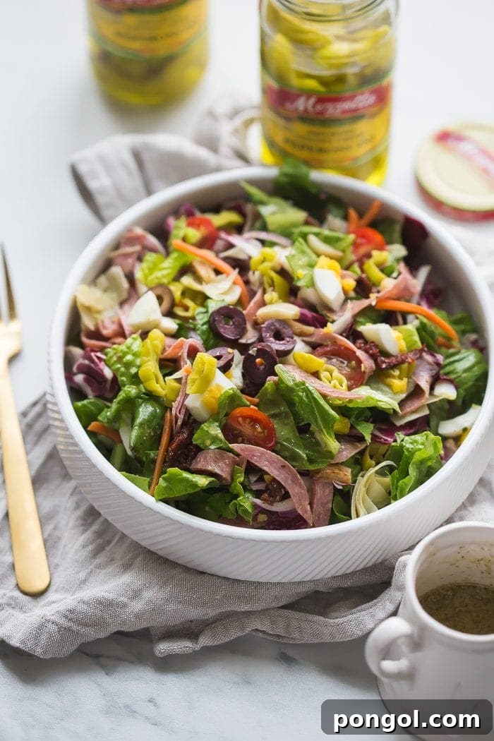 Close-up of Mezzetta Pepperoncinis in a Paleo Italian Salad, adding a bright pop of color and flavor.