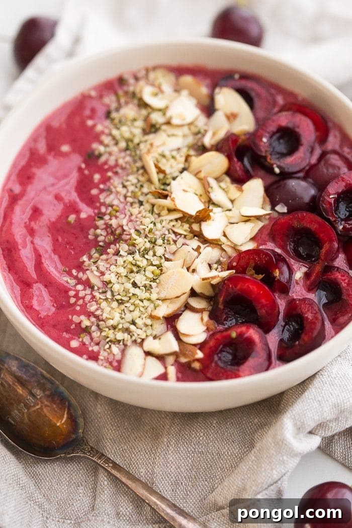 A vibrant and refreshing cherry smoothie bowl, perfect for a healthy breakfast or snack.