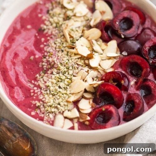 Cherry smoothie bowl with toppings