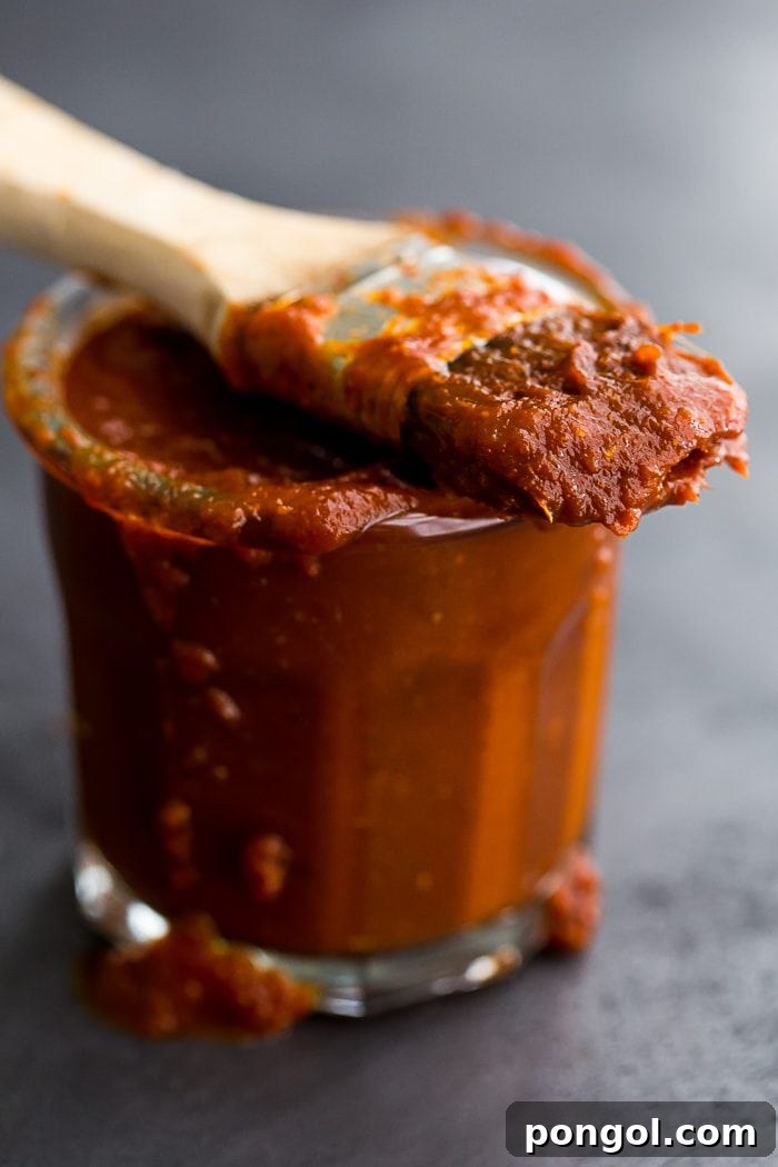 This Whole30 BBQ sauce is a delicious Whole30 condiment. Perfect on ribs, pulled pork, or chicken, this Whole30 BBQ sauce is spiced with chipotle powder and lightly sweetened with coconut aminos. A jar of this Whole30 BBQ sauce in the fridge will mean plenty of simple, flavorful Whole30 dinners!