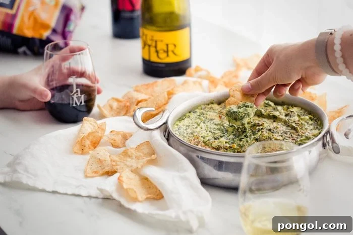 Creamy Paleo Vegan Spinach Artichoke Dip 5 Friends enjoying drinks and appetizers at a casual gathering