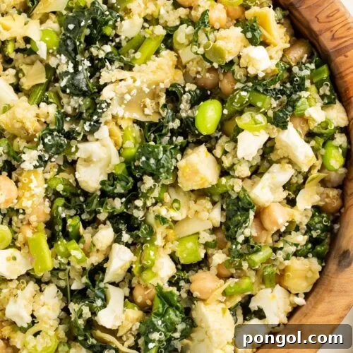 A close-up of a bowl of my favorite detox salad, loaded with chickpeas, quinoa, feta cheese, and more.