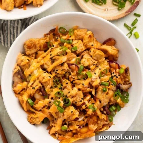 Two bowls of chicken egg roll in a bowl on a table.