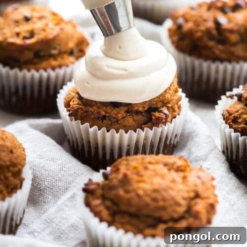 Top view of Paleo Pumpkin Chocolate Chip Muffins with Cream Cheese Frosting, highlighting the rich flavors and inviting presentation.