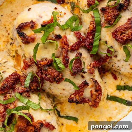 Close-up of creamy marry me chicken casserole in a casserole dish, ready to be served.