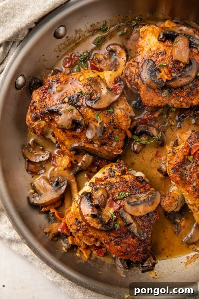 Whole30 Mushroom bacon chicken thighs in a skillet