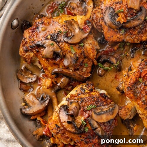 Whole30 Mushroom bacon chicken thighs in a skillet