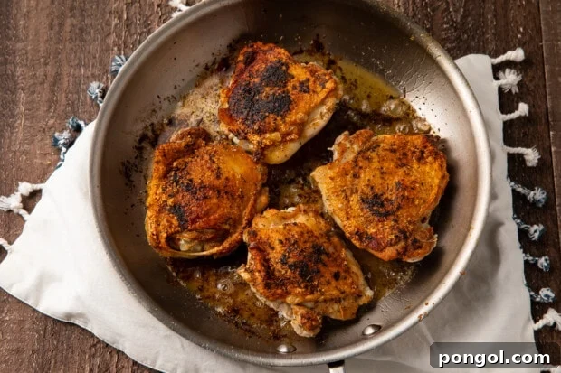 Chicken thighs in large skillet