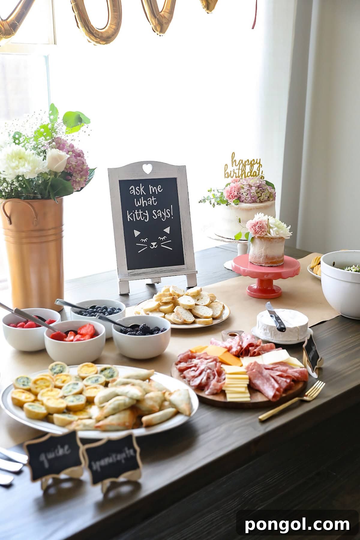French-inspired food set up on a dark wood picnic table for a French flower stall birthday party.