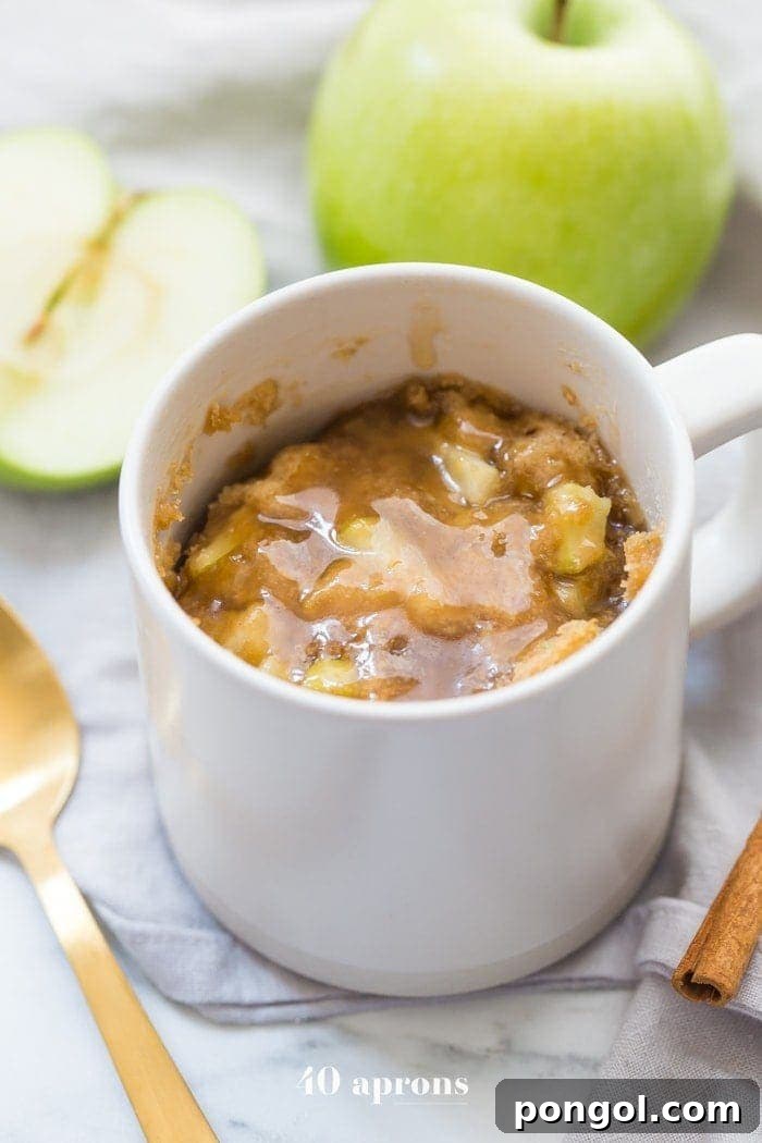 Paleo Caramel Apple Mug Cake 2 A deliciously moist Paleo Caramel Apple Microwave Cake with tender green apples and a rich 2-minute caramel sauce, perfect for a quick, healthy dessert.