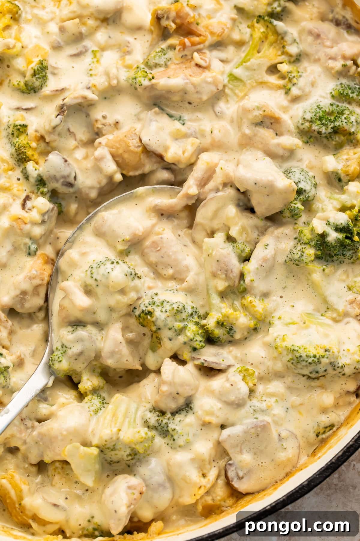 Close-up of Whole30 creamy chicken casserole showing sauce coating broccoli and chicken pieces