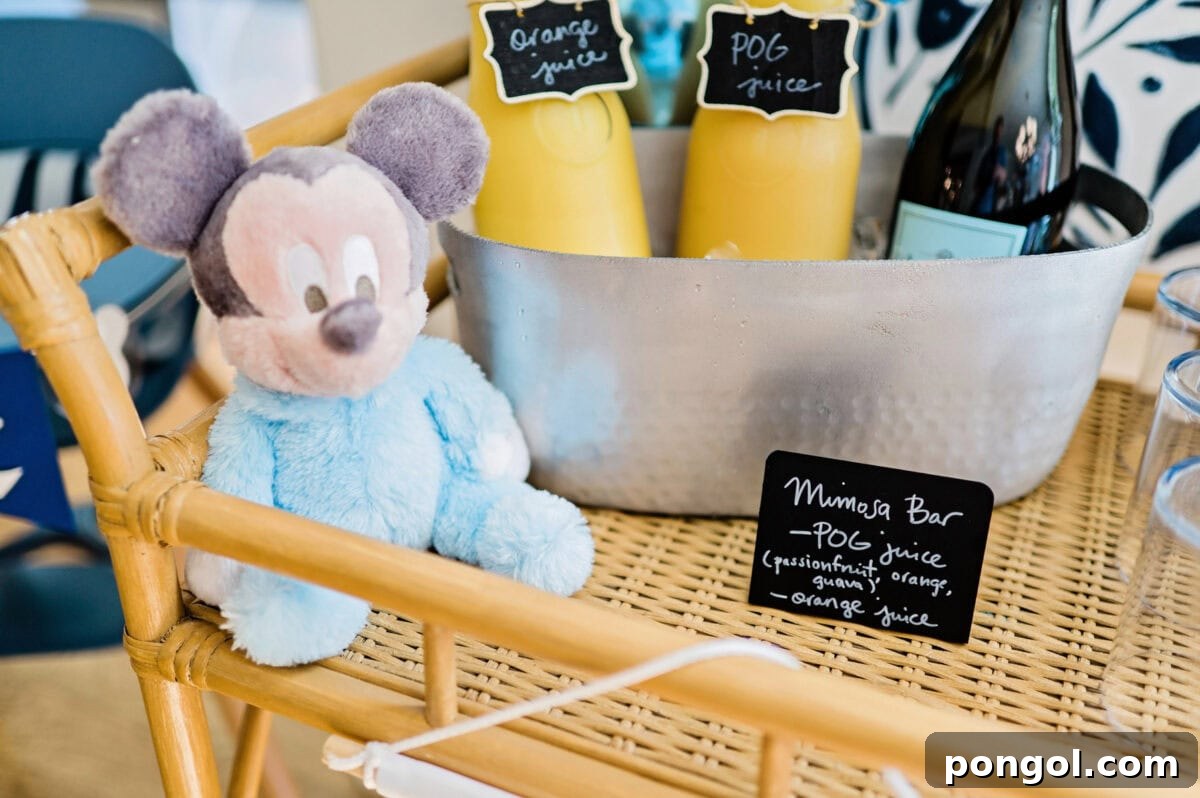 A mimosa bar on a rattan cart themed for a Magic Kingdom birthday party.