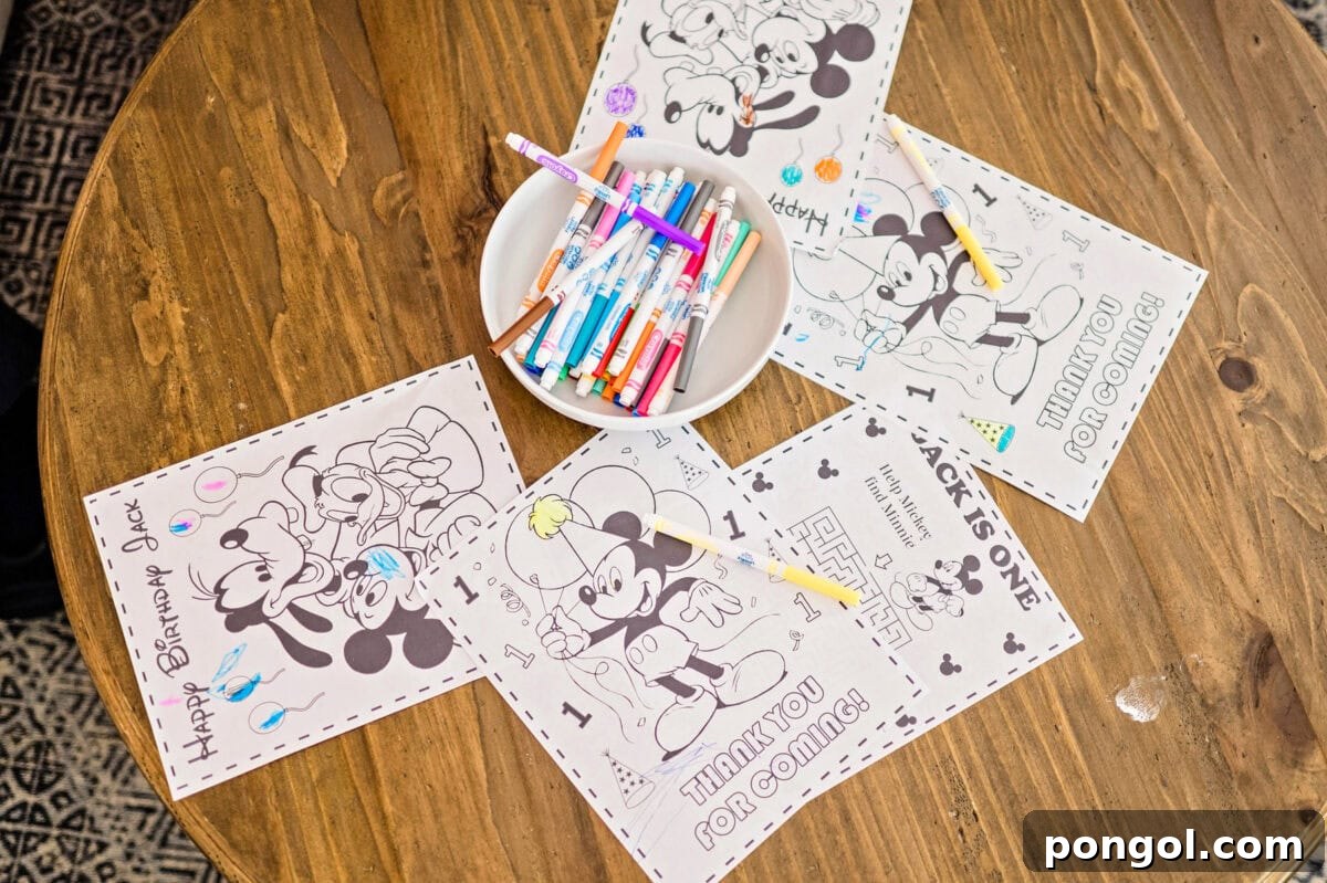 Coloring pages and crayons spread across a coffee table.