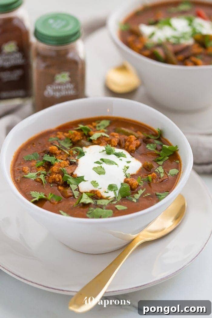 Hearty Whole30 Paleo Chicken Tikka Masala Chili 2 This chicken tikka masala chili is the stuff your dreams are made of. This Whole30 chili has a rich and creamy tomato sauce, with beautiful caramelized onions, garlic, and chiles, loaded with tender ground chicken and veggies. Inspired by my beloved chicken tikka masala recipe, this chicken tikka masala chili is a must make for fall! It'll surely become your favorite Whole30 chili, too.