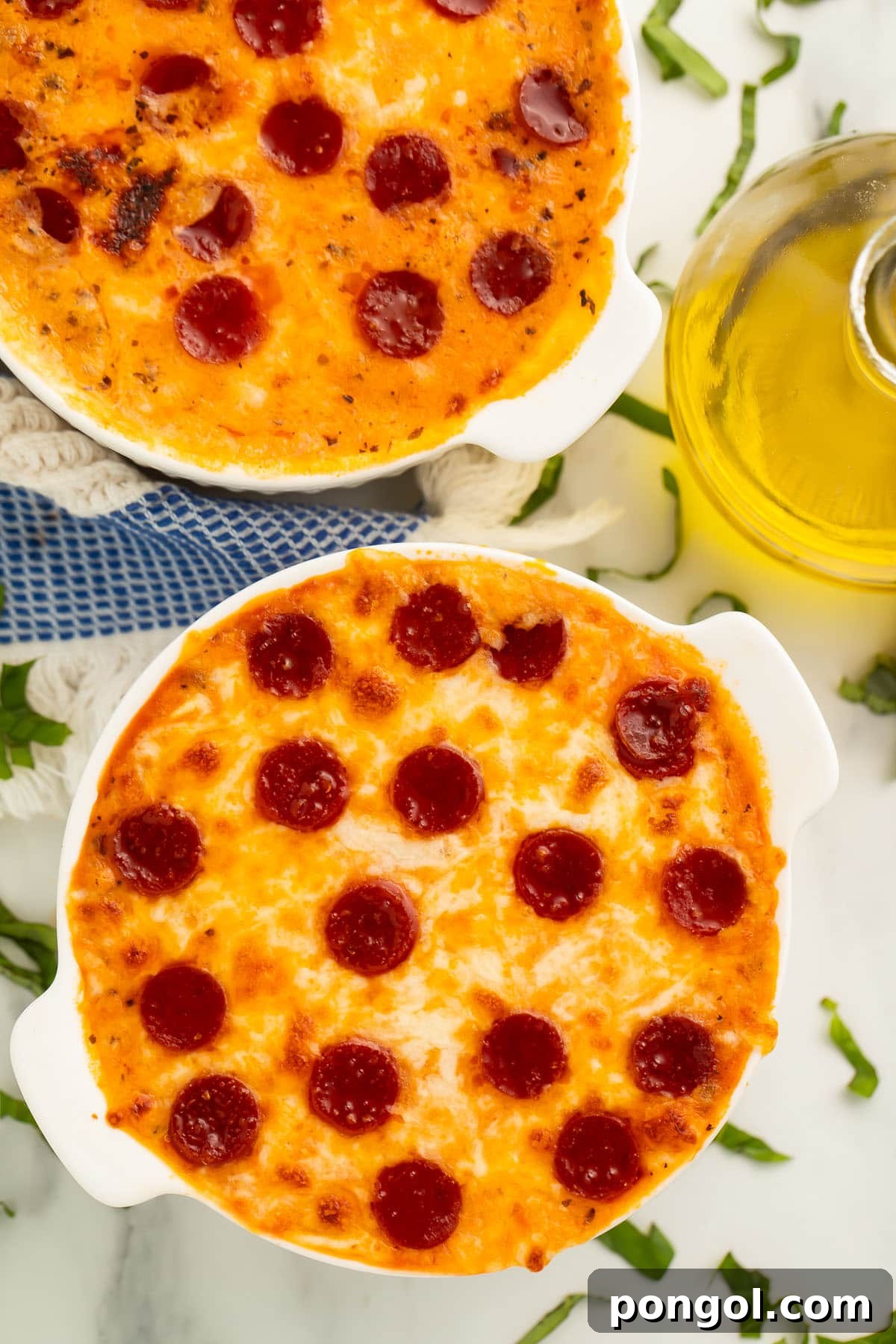 Fit Cottage Cheese Pizza Bowl 3 A vibrant, delicious cottage cheese pizza bowl topped with melted cheese, pepperoni, and fresh basil, ready for enjoyment.